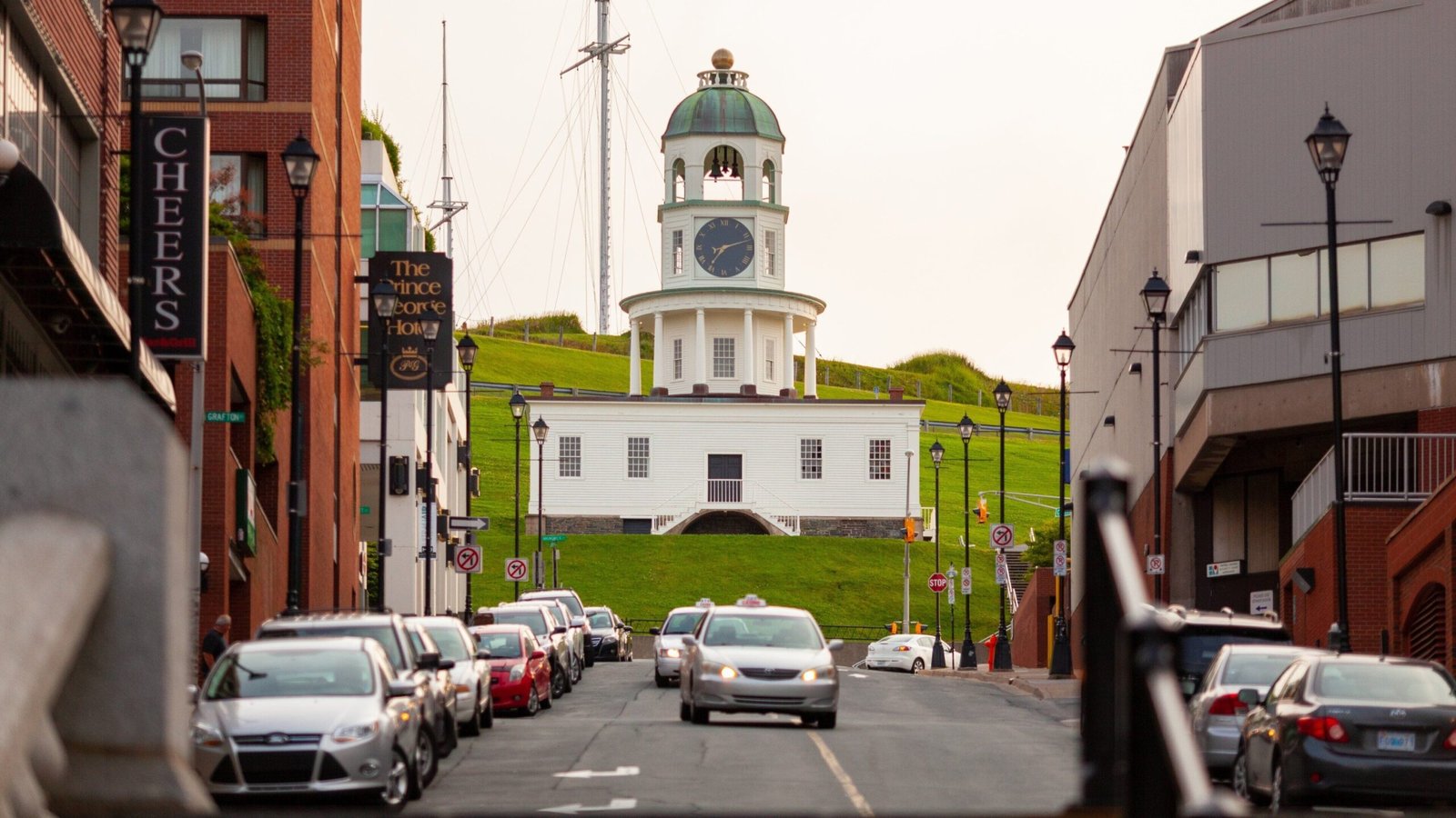 Halifax Town Clock on green hill viewed from downtown street - Manchester Airport Taxi Transfer - Manchester Airport Taxi Transfer
