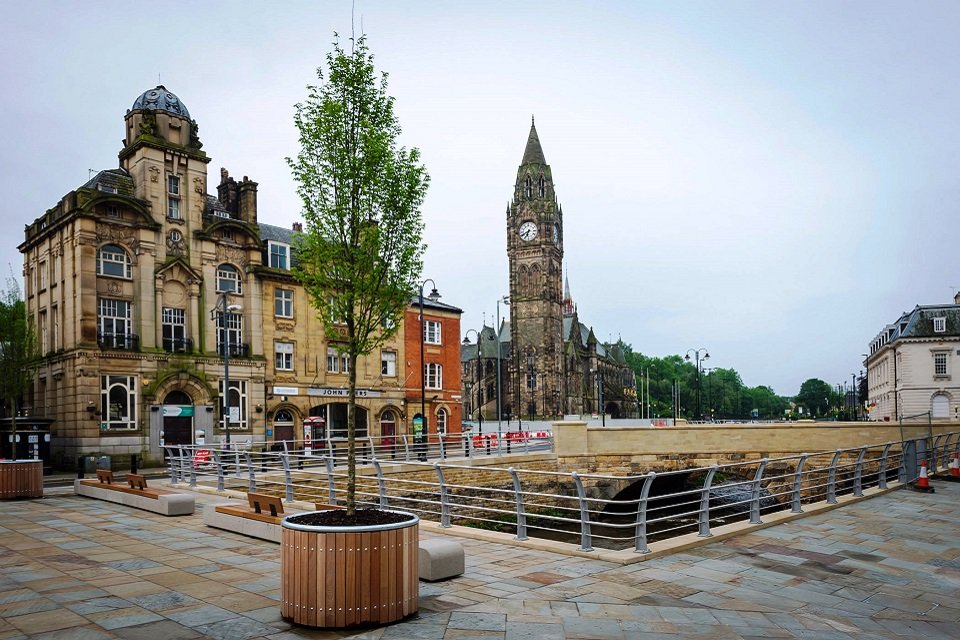 Rochdale town hall clock tower with renovated public square and stone buildings. - Manchester Airport Taxi Transfer - Manchester Airport Taxi Transfer
