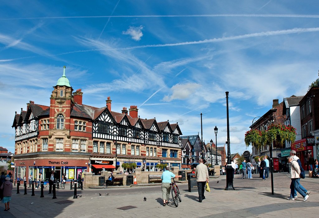 Wigan town centre with Tudor buildings and blue sky. - Manchester Airport Taxi Transfer - Manchester Airport Taxi Transfer