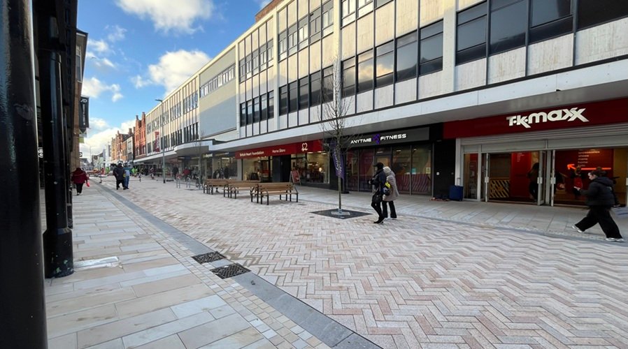 Warrington pedestrian shopping street with TK Maxx and shoppers. - Manchester Airport Taxi Transfer - Manchester Airport Taxi Transfer